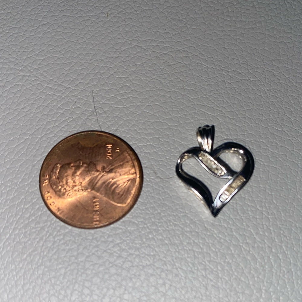 14 karat white gold and diamond heart pendant